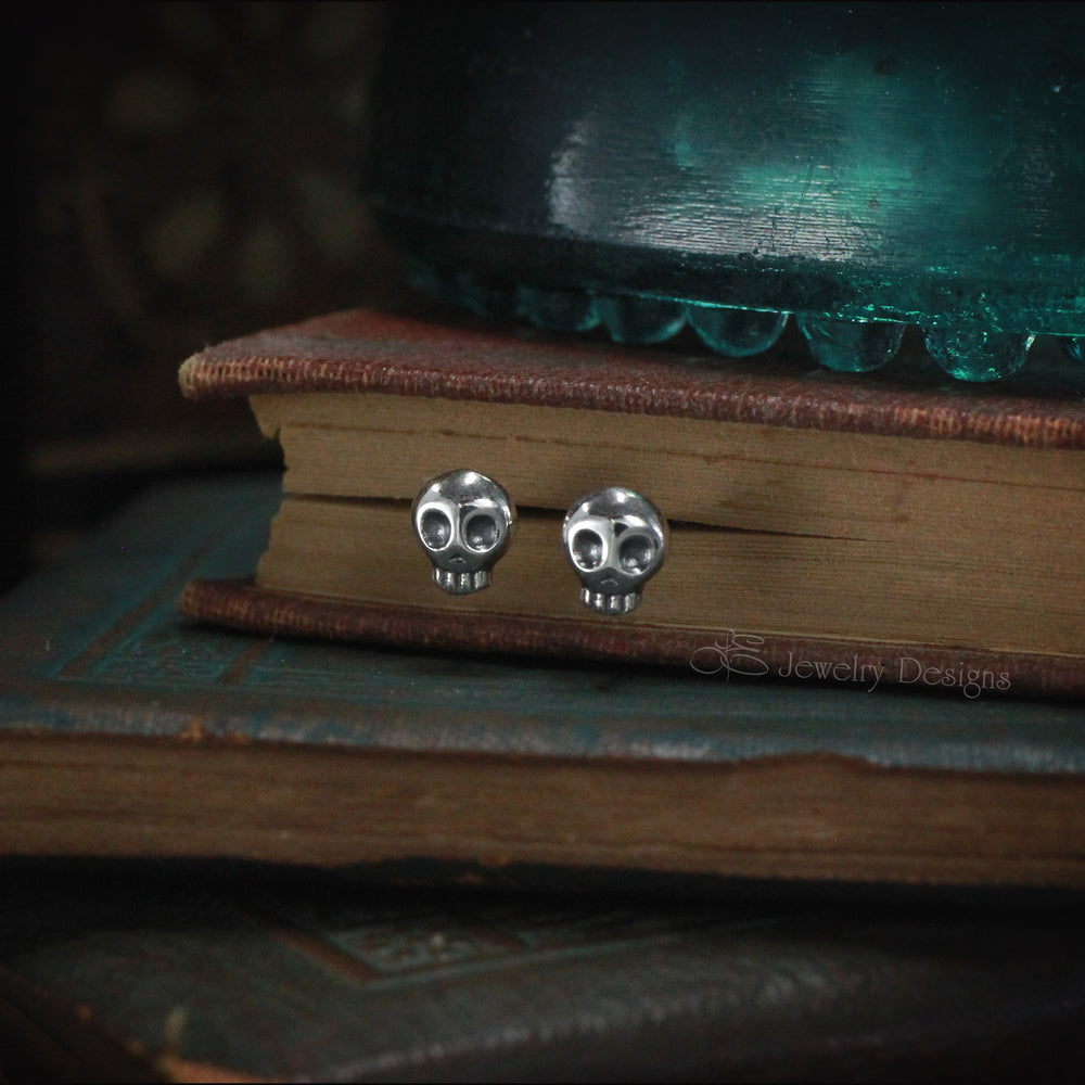 
                  
                    Tiny Sterling Skull Stud Earrings - LE Jewelry Designs
                  
                