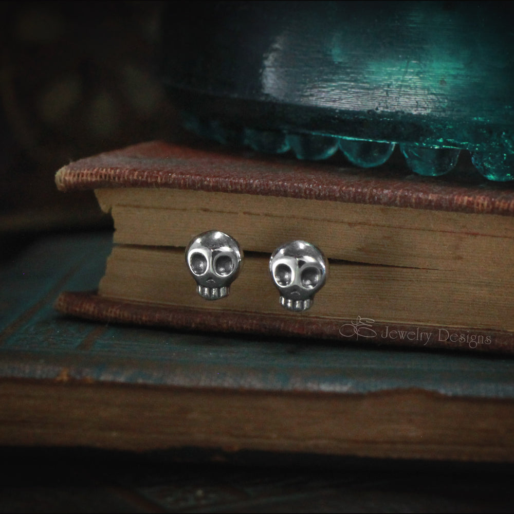 
                  
                    Tiny Sterling Skull Stud Earrings - LE Jewelry Designs
                  
                